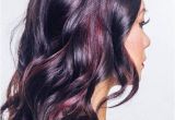 Black Hairstyles Red Highlights Glossy Black Waves with Muted Burgundy Highlights