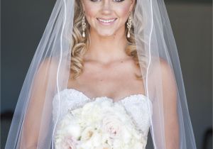 Bridal Hairstyles Half Up Half Down with Veil and Tiara Bride Dress Wedding Down Bouquet Silhouette Cathedral Veil Make Up