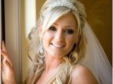 Bridal Hairstyles Half Up Half Down with Veil and Tiara Bride with Wavy Hair and Tiara Wedding Hairstyles