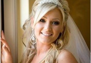 Bridal Hairstyles Half Up Half Down with Veil and Tiara Bride with Wavy Hair and Tiara Wedding Hairstyles