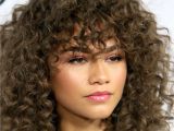 Curly Hairstyles Pinned to the Side 11 Cute Bang Styles to Try Allure