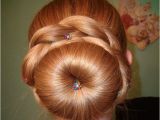 Cute sock Bun Hairstyles the Fluffy sock Bun is Surrounded by Thick Braids A Neat