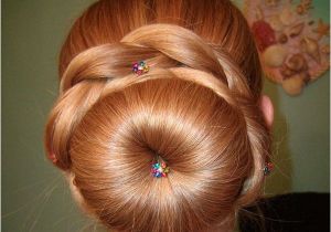 Cute sock Bun Hairstyles the Fluffy sock Bun is Surrounded by Thick Braids A Neat