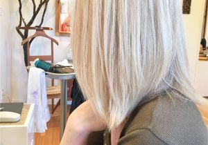 Feather Cut Hairstyle for Girls toning with All Over Highlights On A Natural Dirty Blonde
