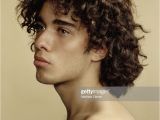 Hispanic Curly Hairstyles Young Hispanic Man with Curly Hair Looking Away Closeup