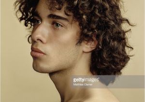 Hispanic Curly Hairstyles Young Hispanic Man with Curly Hair Looking Away Closeup