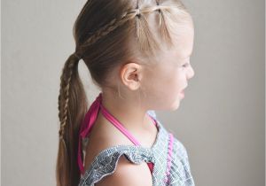 Little Girl Cheer Hairstyles Elastics and Braids Into A Ponytail Teswood Q S Hairdos