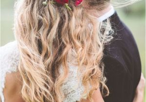 Wedding Hairstyles Half Up with Flowers Red Flower Detail In Wedding Hairstyle with Long Messy Waves