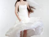 Wedding Hairstyles Real Brides Portrait Od A Bride with Long Dark Hair In Wedding Dress isolated