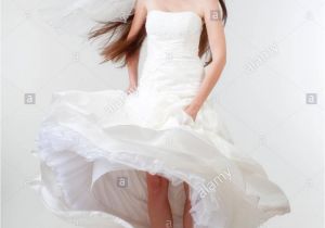 Wedding Hairstyles Real Brides Portrait Od A Bride with Long Dark Hair In Wedding Dress isolated