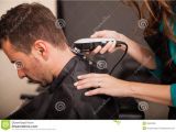 What to ask for when Getting A Haircut Men Getting Haircut at A Salon Stock Image